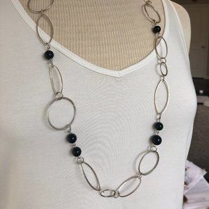 Silver coloured necklace with black accent beads